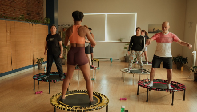 Trampoline fitness class in progress at Studio Surya Montréal